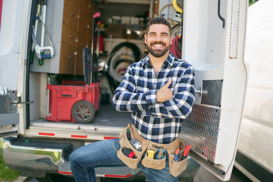 home-service-tech-standing-next-to-his-truck